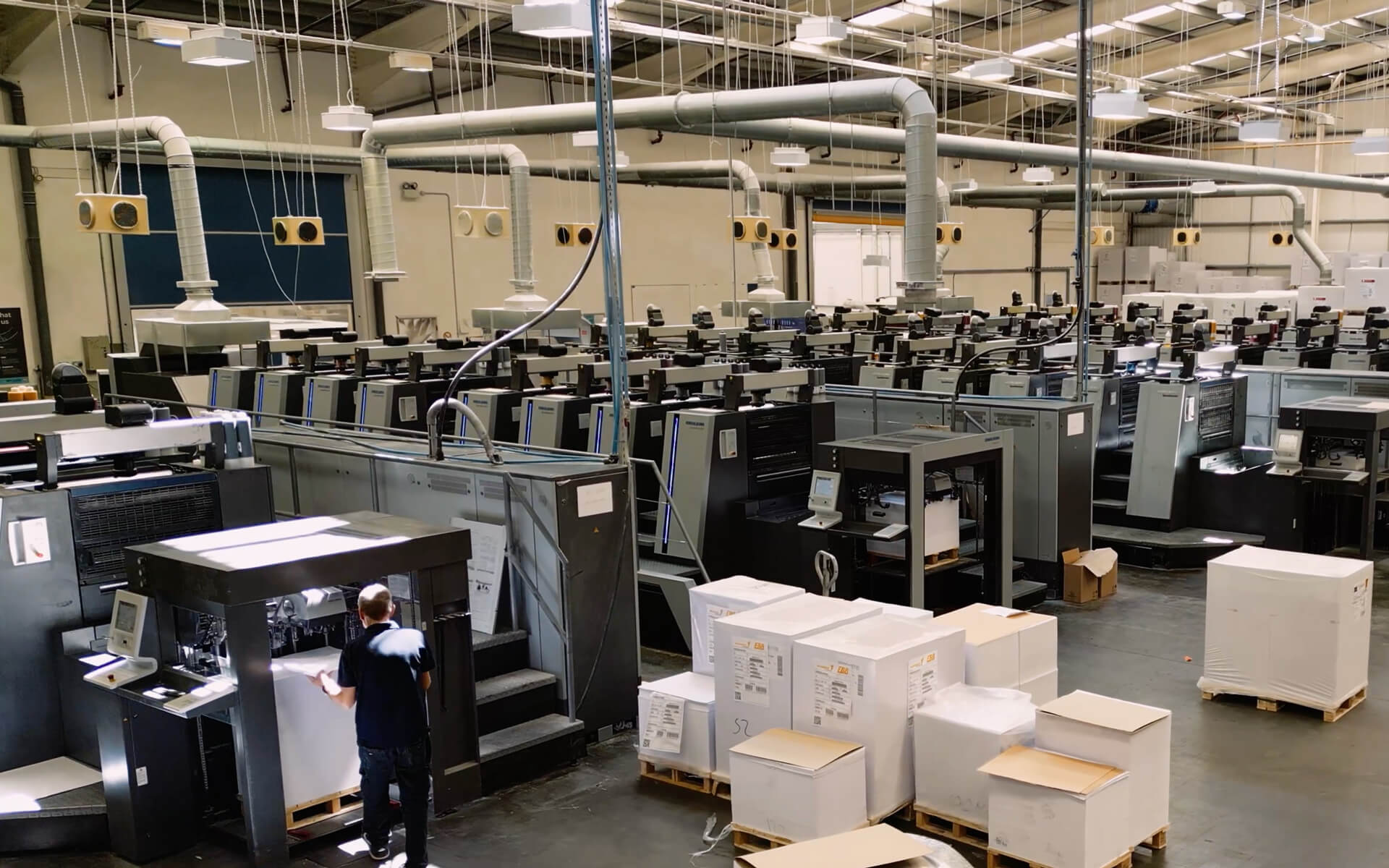 Bishops print staff checking a printed sheet